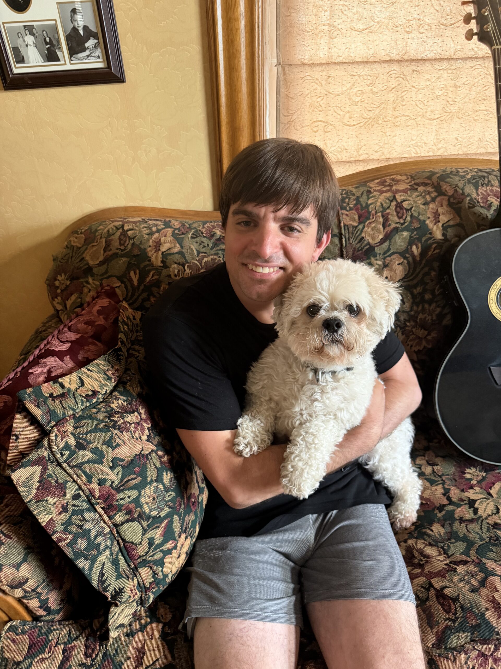 Justin holding his family dog.